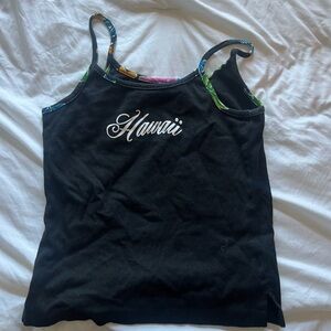 Bought this in hawaii, never wore it and is a cute top for low waisted items!